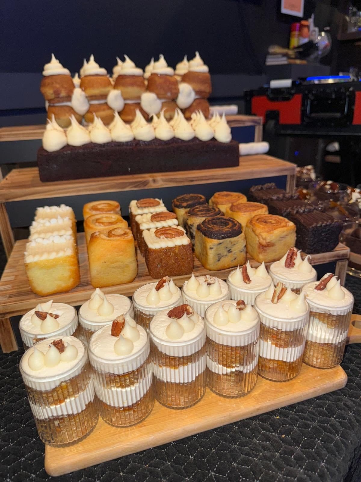 Dessert table with cakes, babka, and parfait cups at a BHI Thursdays event