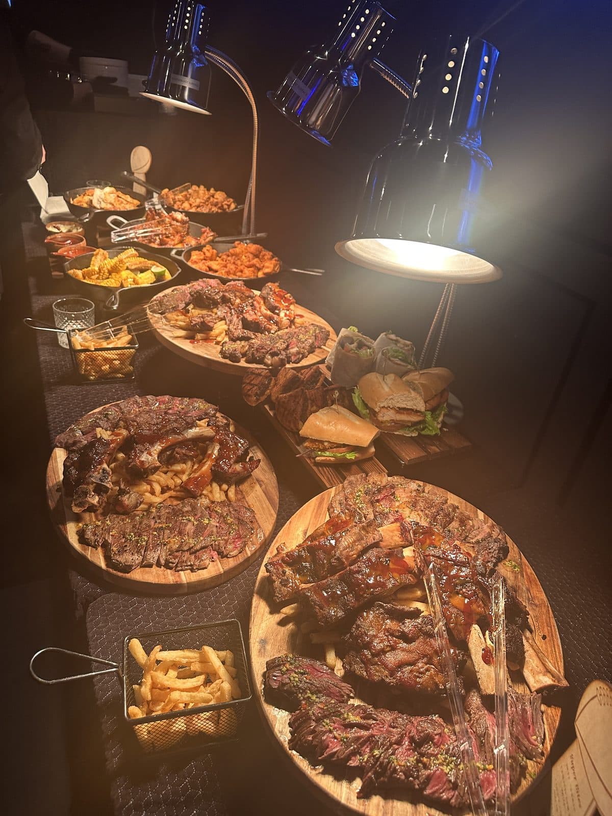 Steak boards and buffet spread at a private party at BHI Thursdays
